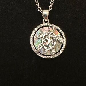 18” adjustable necklace with a turtle charm